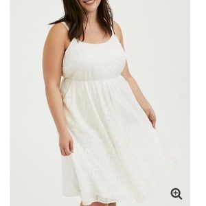 White dress with gold chevron stitch detailing
